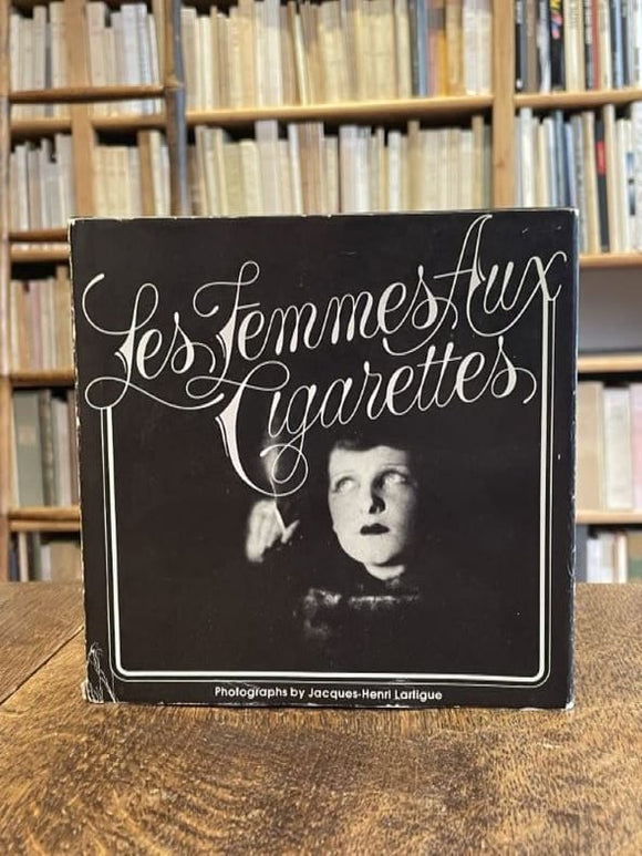 Smoking LARTIGUE (Jacques-Henri). | Les Femmes aux cigarettes. Designed and produced by Sheldon Cotler.